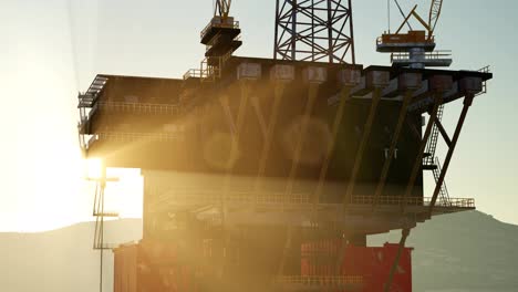 An-offshore-oil-platform-at-sunset-light